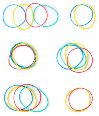 Set of colorful elastic bands on white background, top view