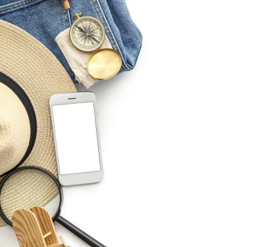 Accessories for travelling with mobile phone on white background