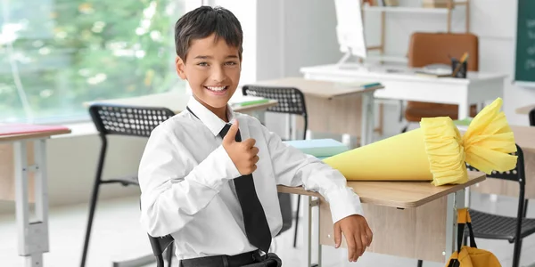Happy Little Boy School Cone Showing Thumb Gesture Classroom — Stockfoto