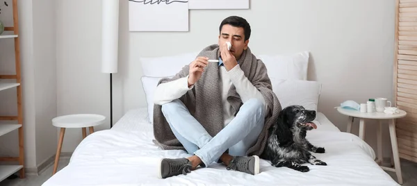 Sick man with his dog at home