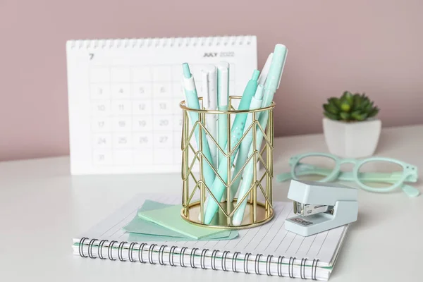 Golden Pen Cup Stationery Table Pink Wall Closeup —  Fotos de Stock