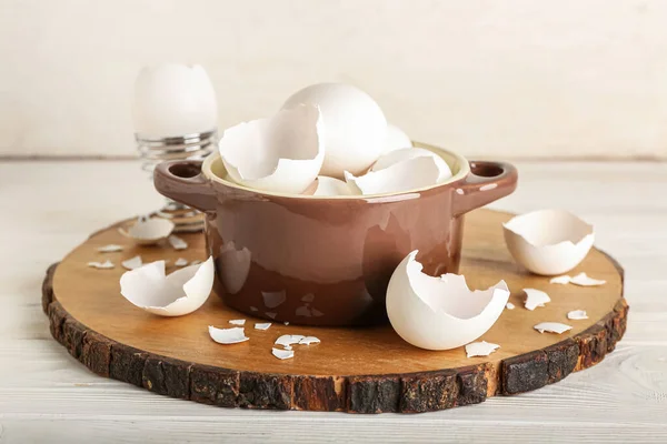 Board Broken Egg Shells Cooking Pot White Wooden Background — Stockfoto