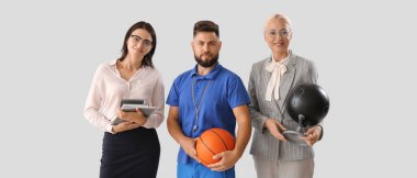 Portrait of different teachers on light background 