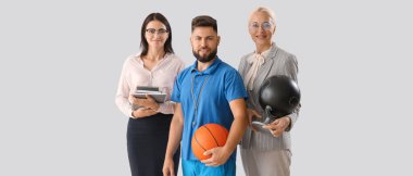 Portrait of different teachers on light background 