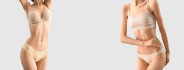 Slim young women in underwear on light background