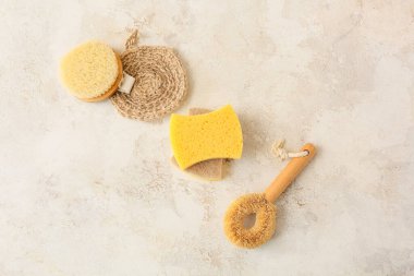 Cleaning supplies on grunge background