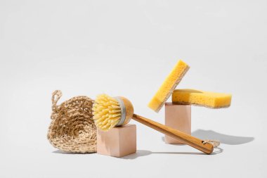 Set of different cleaning supplies on grey background