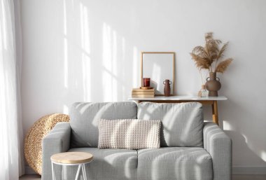 Sofa and table in interior of light living room