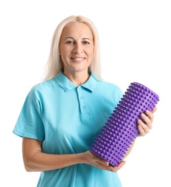 Mature physiotherapist with foam roller on white background