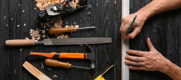 Carpenter Applying Marking Plank Dark Wooden Background Top View — Stock Photo, Image