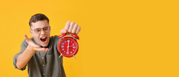 Stressed Teenager Holding Alarm Clock Yellow Background Space Text — ストック写真