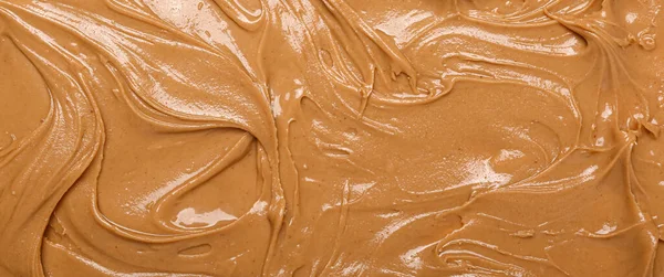 Texture of nut butter as background, closeup