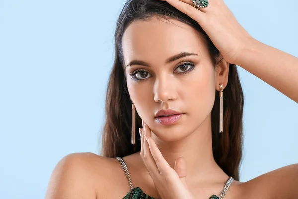 Beautiful Young Woman Stylish Jewelry Light Blue Background — Stockfoto