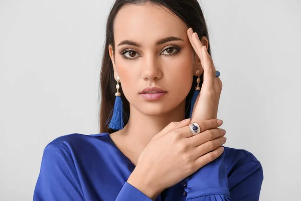 Beautiful Young Woman Stylish Jewelry Light Background — Stockfoto