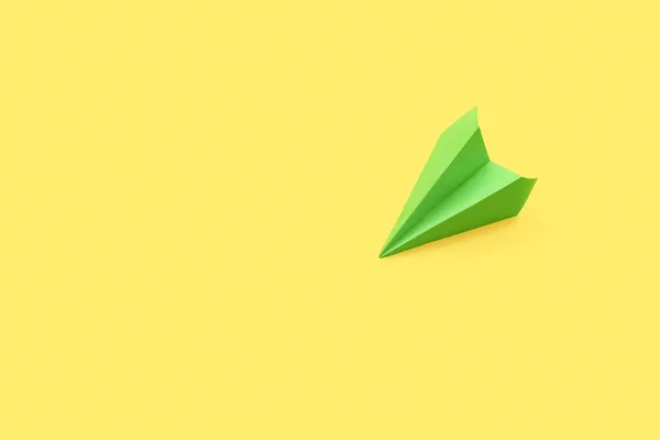 Green Paper Plane Yellow Background — ストック写真