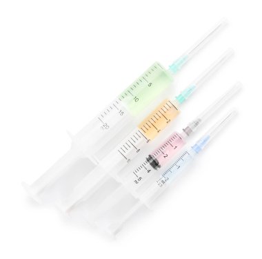 Different medical syringes with vaccine on white background