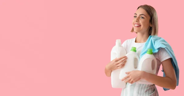 Pretty Young Woman Holding Bottles Detergent Pink Background Space Text — Fotografie, imagine de stoc