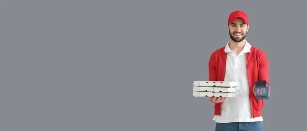 Delivery Man Holding Cardboard Pizza Boxes Payment Terminal Grey Background — Fotografia de Stock