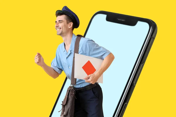 Hurrying Postman Letter Big Mobile Phone Yellow Background — Stock Photo, Image