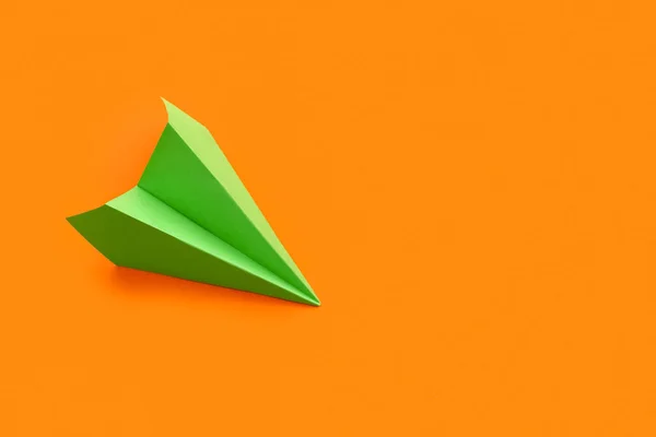 Green Paper Plane Orange Background — Stock Photo, Image