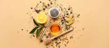 Composition with ingredients for tasty ginger tea on beige background, top view