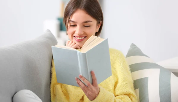 Beautiful Young Woman Reading Interesting Book Sofa Home — Foto de Stock