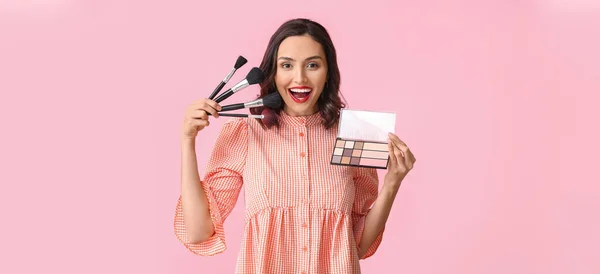 Beautiful Young Woman Makeup Brushes Eyeshadows Pink Background — Fotografia de Stock