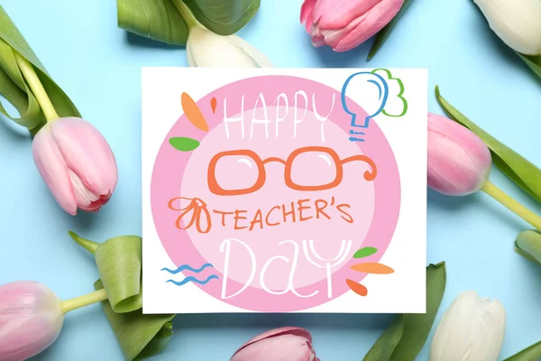 Greeting card for Teacher\'s Day and many tulips on light blue background