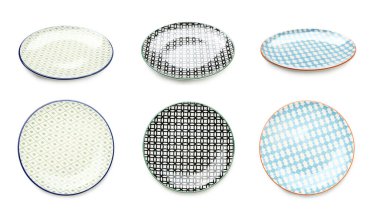 Set of empty ceramic plates isolated on white