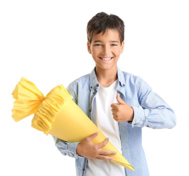Little boy with yellow school cone showing thumb-up on white background