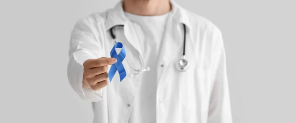 Doctor Holding Blue Ribbon Light Background Closeup Prostate Cancer Awareness — Fotografia de Stock