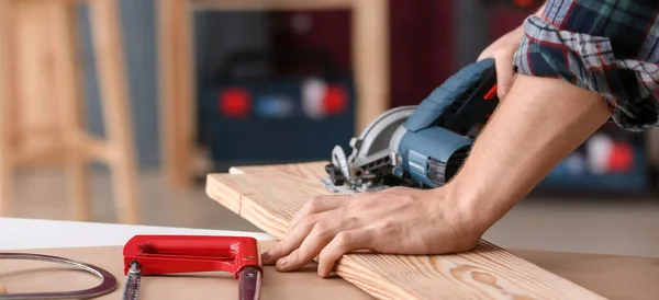 Male Carpenter Cutting Plank Workshop Closeup —  Fotos de Stock