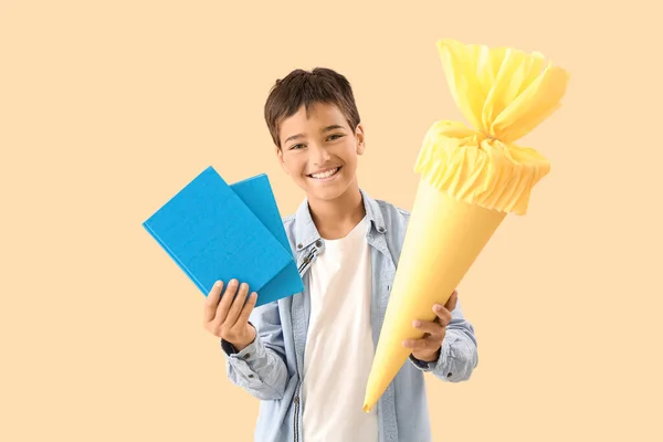 Little Boy Yellow School Cone Books Beige Background — Stockfoto