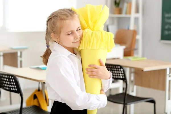 Cute Little Girl Hugging Yellow School Cone Classroom — Stok Foto