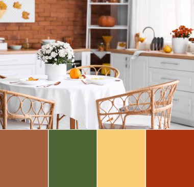 Dining table with beautiful chrysanthemum flowers and autumn decor in interior of modern kitchen. Different color patterns
