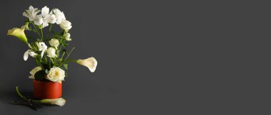 Beautiful ikebana on dark background with space for text