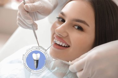 Young woman with implanted teeth visiting dentist in clinic