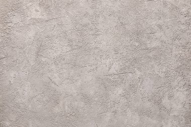 Grey grunge wall as background, closeup