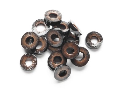 Heap of cut black olives isolated on white background