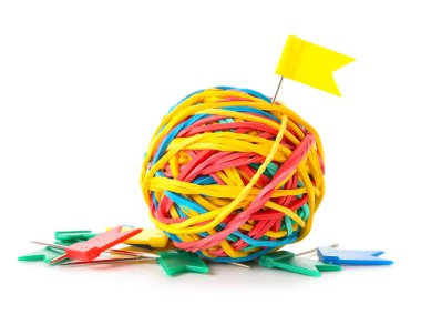 Colorful rubber band ball and paper pins on white background