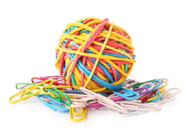 Colorful rubber band ball and paper clips on white background