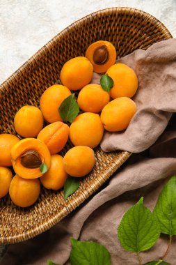 Basket with ripe apricots, closeup