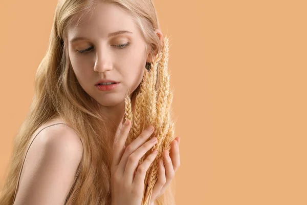 Young Woman Wheat Ears Beige Background — Stockfoto