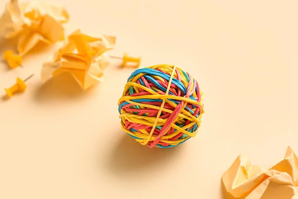 Colorful Rubber Band Ball Crumpled Paper Pins Beige Background — Foto de Stock