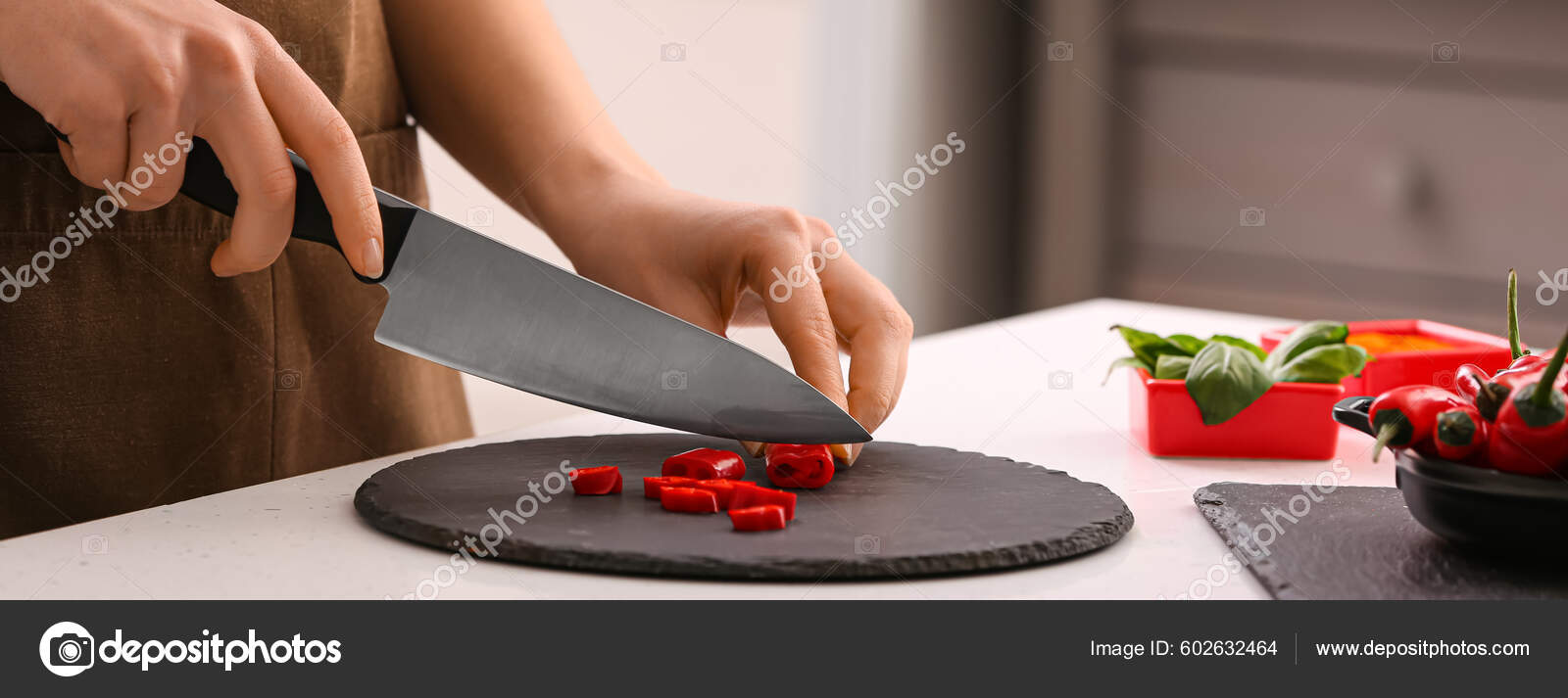 Woman Knife Cutting Hot Chili Pepper Kitchen Stock Photo by ©serezniy