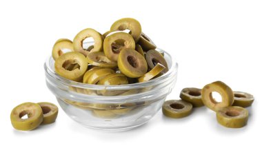 Glass bowl of cut green olives on white background