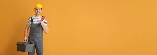 Handsome Male Plumber Orange Background Space Text — Foto de Stock