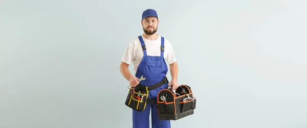Handsome Worker Tools Bag Light Background — Stock Photo, Image