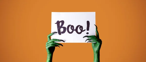 Hands Witch Holding Paper Text Boo Orange Background Halloween Celebration — Stock fotografie