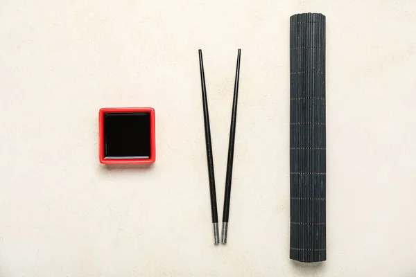 Red Bowl Soy Sauce Chopsticks Bamboo Mat White Background — Foto de Stock